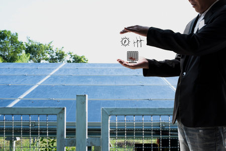 Corporate manager presenting on how to sell electricity from rooftop solar back to the grid. Industry and technology concept for energy producer-consumer, power generation, virtual power plant.の写真素材