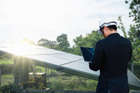 Corporate manager presenting on how to sell electricity from rooftop solar back to the grid. Industry and technology concept for energy producer-consumer, power generation, virtual power plant.の写真素材