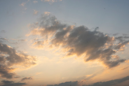 Sunset Sky on Twilight in the Evening with Orange Gold Sunset Cloud Nature Sky Backgrounds, Horizon Golden Sky, Sunrise clouds Gorgeous, Dusk skyの写真素材