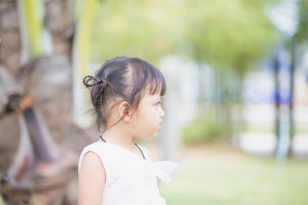 Portrait of a young Asian girl smiling at the camera - Happy Thai girl having fun posing.の写真素材