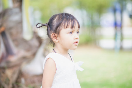Portrait of a young Asian girl smiling at the camera - Happy Thai girl having fun posing.の写真素材