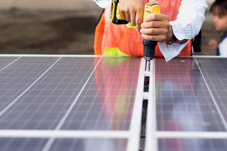 Male electrician installs solar panels solar energy Clean and environmentally friendly alternative...