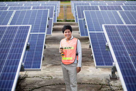 Male electrician installs solar panels solar energy Clean and environmentally friendly alternative energy.の写真素材