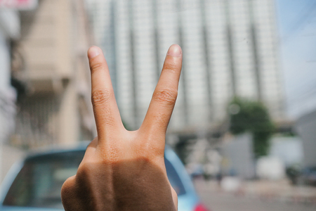 Hand show v sign languageの写真素材