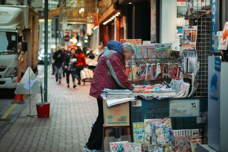Vendor selling comics and newspaper in Hong Kong streetの写真素材