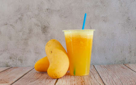 Fresh mango juice and a mango fruitsの写真素材