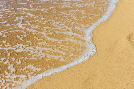 Wave and sand beach