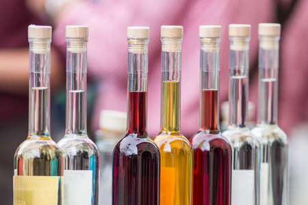 Set of colourful bottles on unsharp backgroundの写真素材