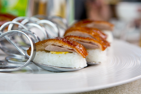 Cherry duck with cheese and rice on the white disheの写真素材