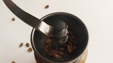 Wooden coffee mill and coffee beansの写真素材