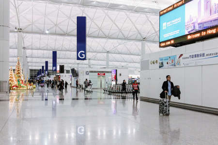 Hong Kong - December 28, 2013: Hong Kong International Airport (Chek Lap Kok Airport) Terminal 1 at night-time after Christmas Dayのeditorial素材
