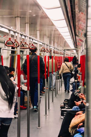 Hong Kong - December 29, 2013: Passengers walking in Hong Kong MTR (Mass Transit Railway) Trainのeditorial素材