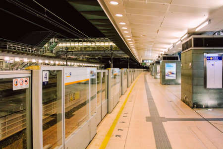 Lantau Island, Hong Kong, China - December 29, 2013: Hong Kong MTR Sunny Bay Station Platform at Nighttimeのeditorial素材
