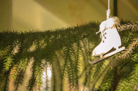Christmas tree decoration with figure skates and pine branches. Christmas backgroundの写真素材
