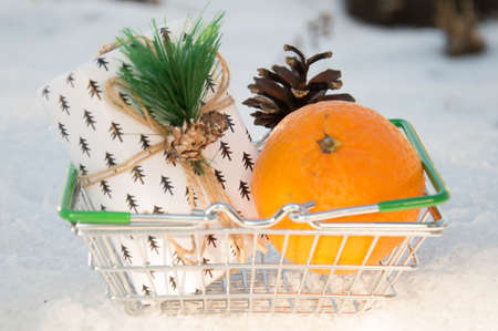 Christmas and New Year gifts in a shopping basket. Selective focus.の写真素材