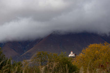 Kazbegi region of Georgia, snow capped mountains and rugged terrainの写真素材