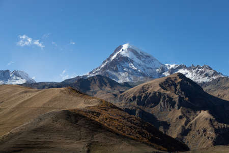 Kazbegi region of Georgia, snow capped mountains and rugged terrain