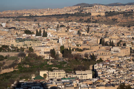 Fes Morocco cityscape with medina in centre seen from hills above in bright sun