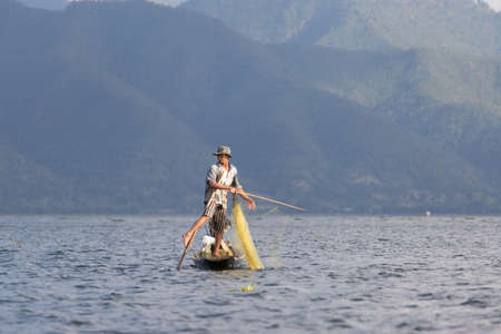 Inle Lake, Myanmar 12/16/2015 traditional Intha fisherman rowing with one legのeditorial素材