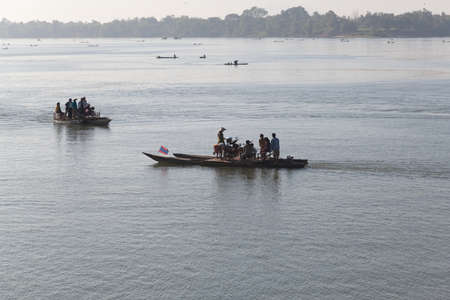 Mekong River Laos from the water showing riverbank activity and boatsのeditorial素材