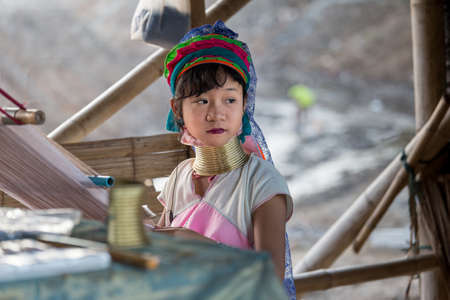Chiang Rai Thailand 10.12.2015 Karen village with long neck women weaving scarfのeditorial素材