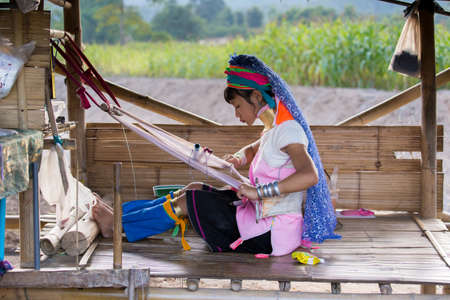 Chiang Rai Thailand 10.12.2015 Karen village with long neck women weaving scarfのeditorial素材
