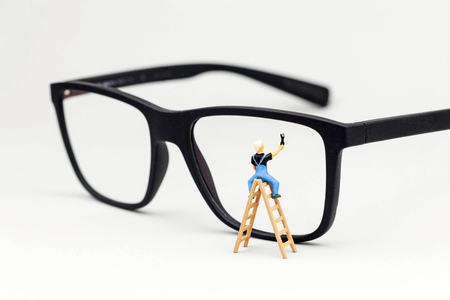 miniature window cleaner cleans glassesの写真素材