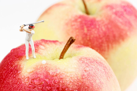 miniature golfer on an apple golf courseの写真素材