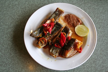 Spicy grilled rayfish traditional asian cuisine on white plateの写真素材