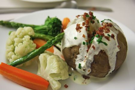 Plate of assorted vegetables side dish in restaurantの写真素材
