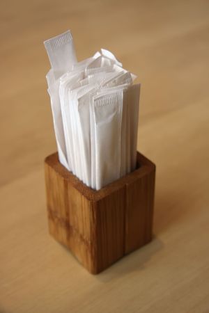Individually wrapped toothpicks in wooden container Japanese restaurantの写真素材