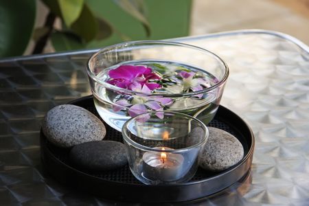 Tropical asian ornament decoration floating flowers in bowlの写真素材