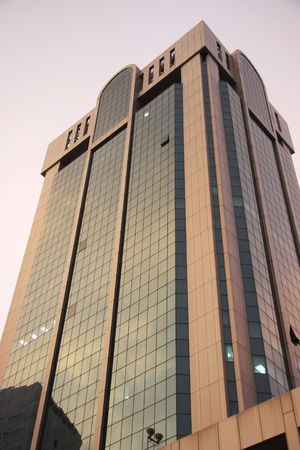Modern corporate building glass and steel at sunrise