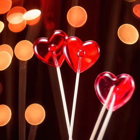 Heart shaped lollipops, a sweet treat to celebrate romance, love and Valentine's dayの素材
