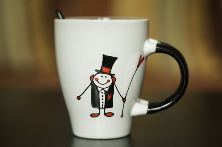 black and white wedding cup with a picture of a groomの写真素材