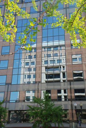 Reflection. Houses are looked in windows each other.の写真素材