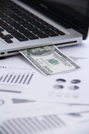 Finance concecpt - money, chart, coin, banknote, keyboard, fin techの写真素材