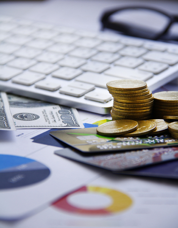 Finance concecpt - money, chart, coin, banknote, keyboard, fin techの写真素材