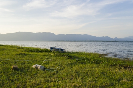 The boat is no nore in used and left at shoreの写真素材