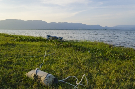 The boat is no nore in used and left at shoreの写真素材