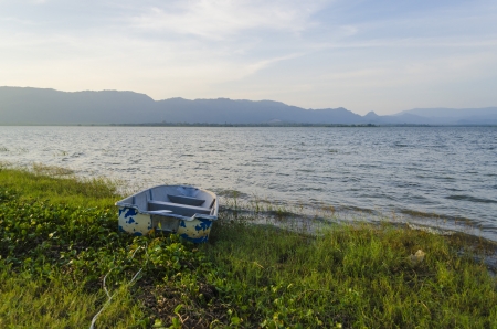 The boat is no nore in used and left at shoreの写真素材