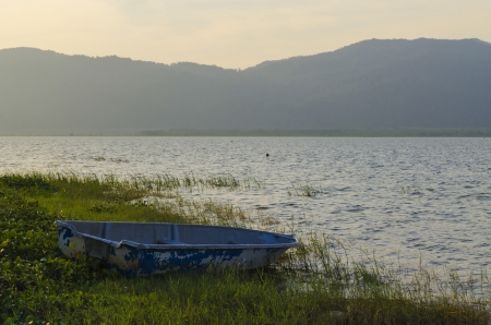 The boat is no nore in used and left at shoreの写真素材