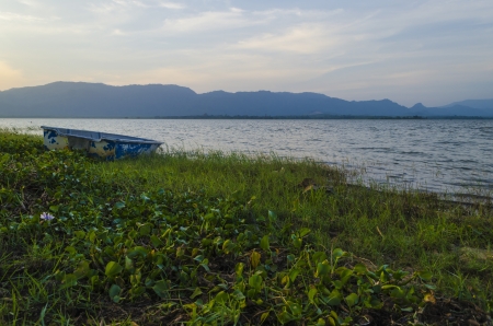 The boat is no nore in used and left at shoreの写真素材