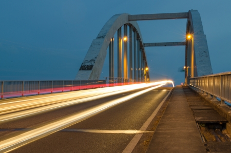 Light trails at kuala Kedah Bridge captured at dusk.の写真素材