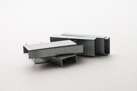 Staples stick/clip that can be used with stapler to organize paper.