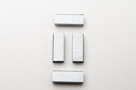 Staples stick/clip that can be used with stapler to organize paper.
