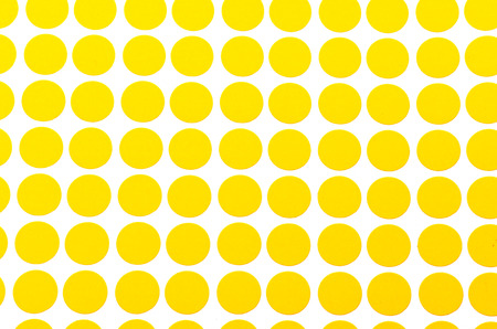 Orange Small Circular Stickers. Shoot on white background. Focus on the closes distance. Can be use for office and school works.の写真素材