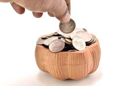 Clay Container with Malaysian Coin. shoot over white background. Produced by using clay materials...