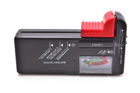 Battery tester. Shoot over white background. Focus on the important part. Shallow depth of field.