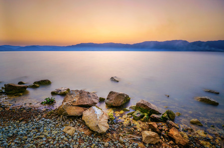 Rock Over Sunset at Lake
